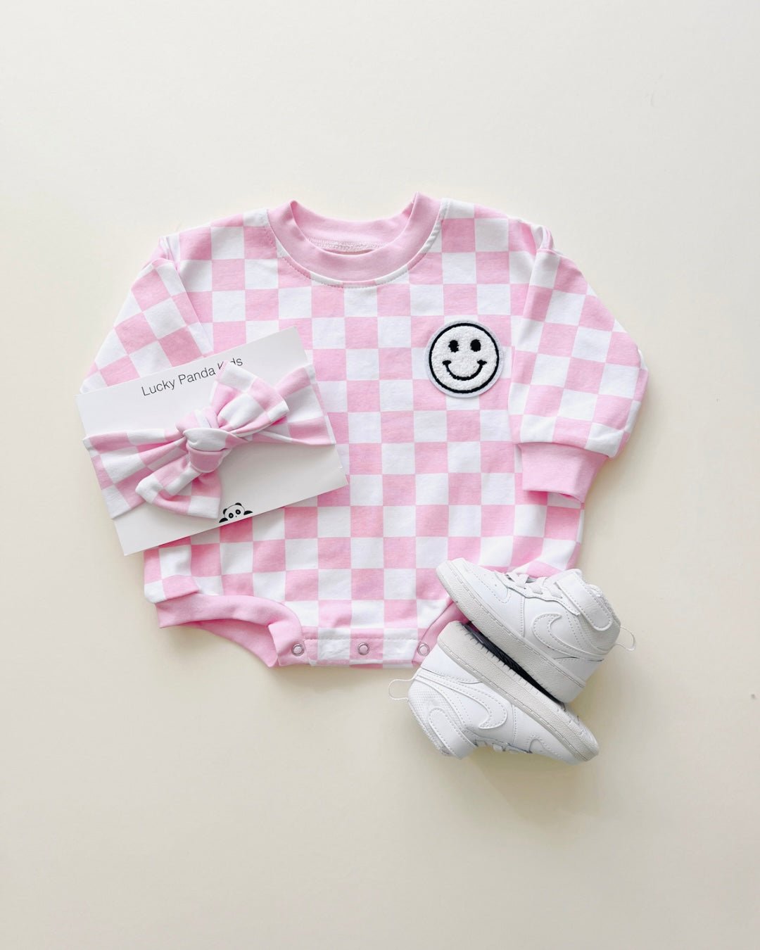 bubble romper // checkered smiley pink