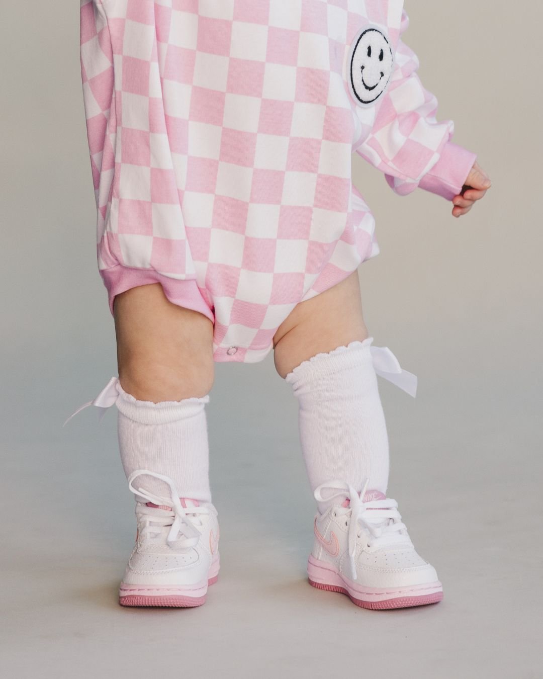 bubble romper // checkered smiley pink