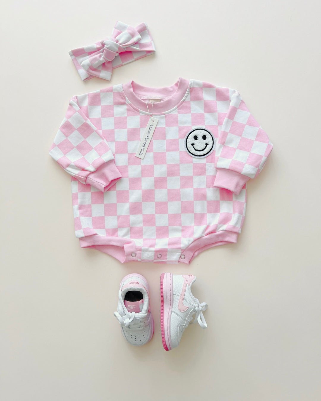 bubble romper // checkered smiley pink