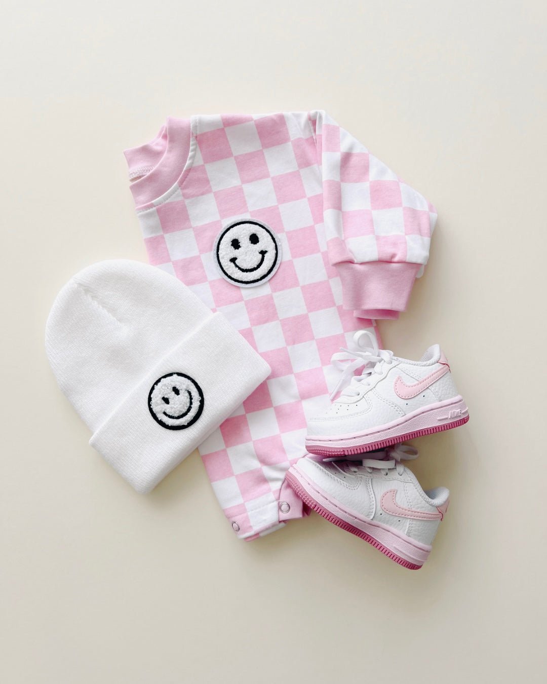 bubble romper // checkered smiley pink